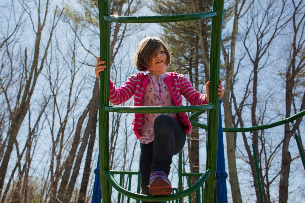 A girl climbing at the playground