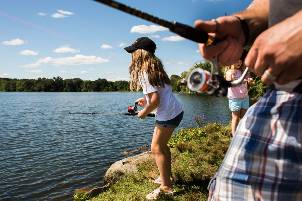 A family is fishing at the lake